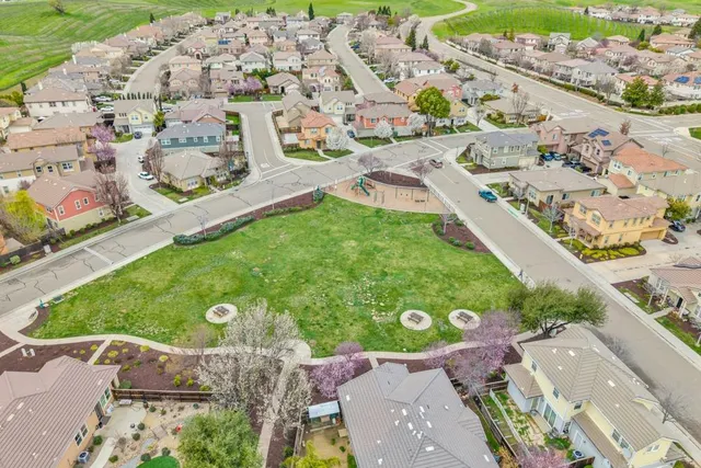 a view of a garden with an outdoor seating