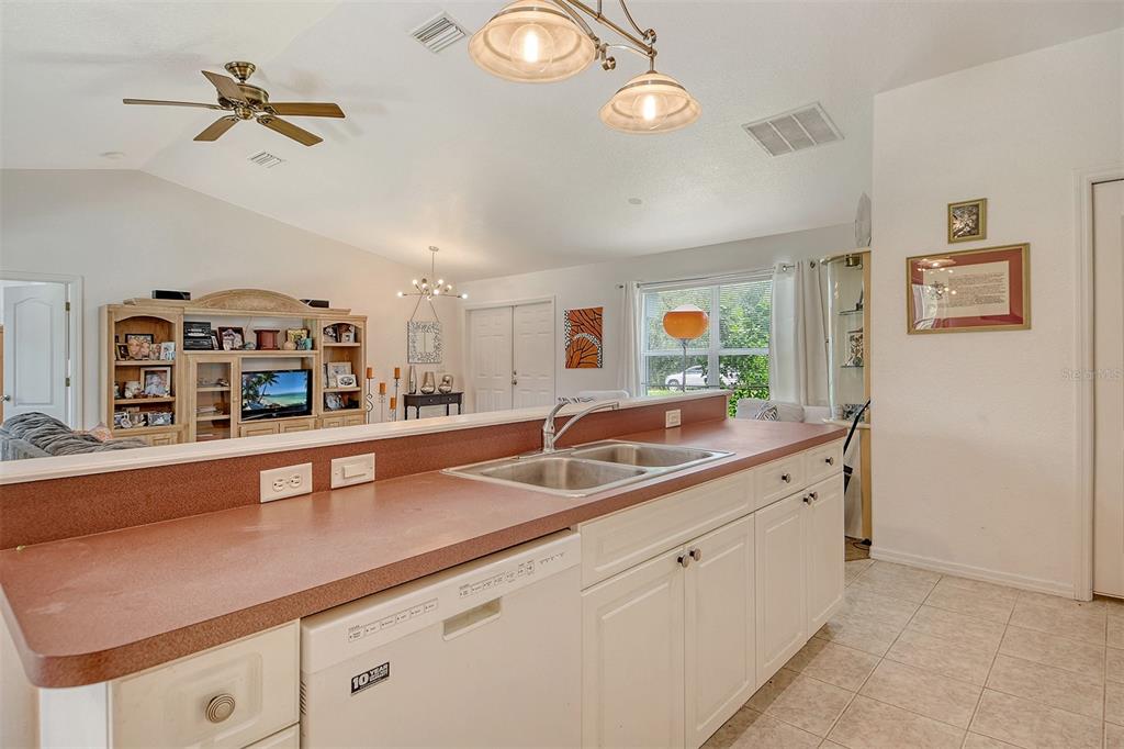 2276 Polaris Road North Port, FL 34291 - Photo 14 of 31 a kitchen with a sink and a stove
