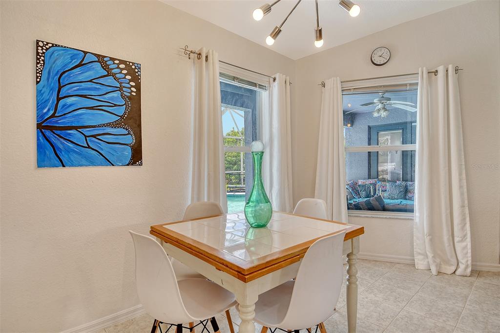 2276 Polaris Road North Port, FL 34291 - Photo 16 of 31 a view of a dining room with furniture and wooden floor
