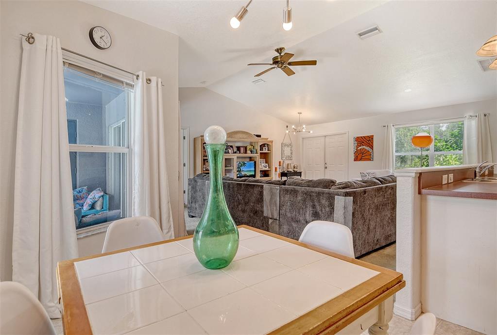 2276 Polaris Road North Port, FL 34291 - Photo 17 of 31 a view of a dining room with furniture and wooden floor
