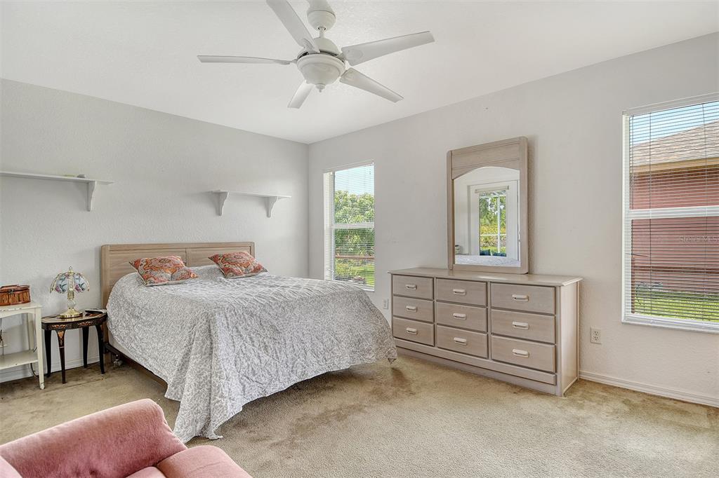 2276 Polaris Road North Port, FL 34291 - Photo 18 of 31 a bedroom with a bed and a dresser