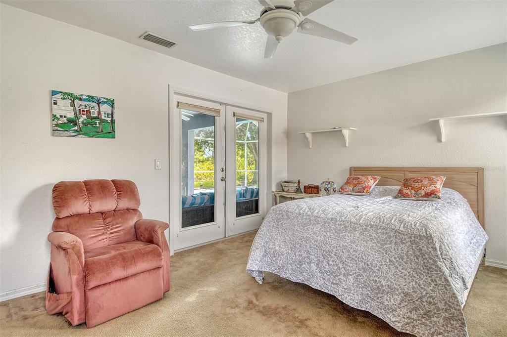 2276 Polaris Road North Port, FL 34291 - Photo 19 of 31 a bedroom with a bed couch and window