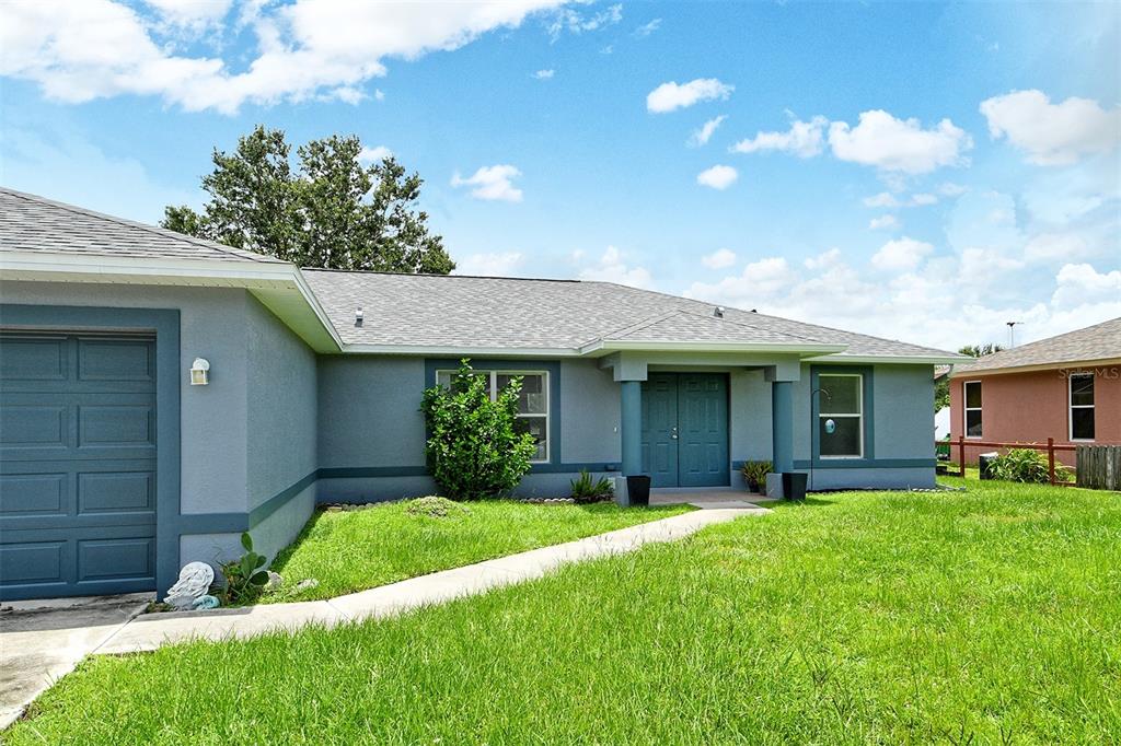 2276 Polaris Road North Port, FL 34291 - Photo 2 of 31 a view of a house with a yard and pathway