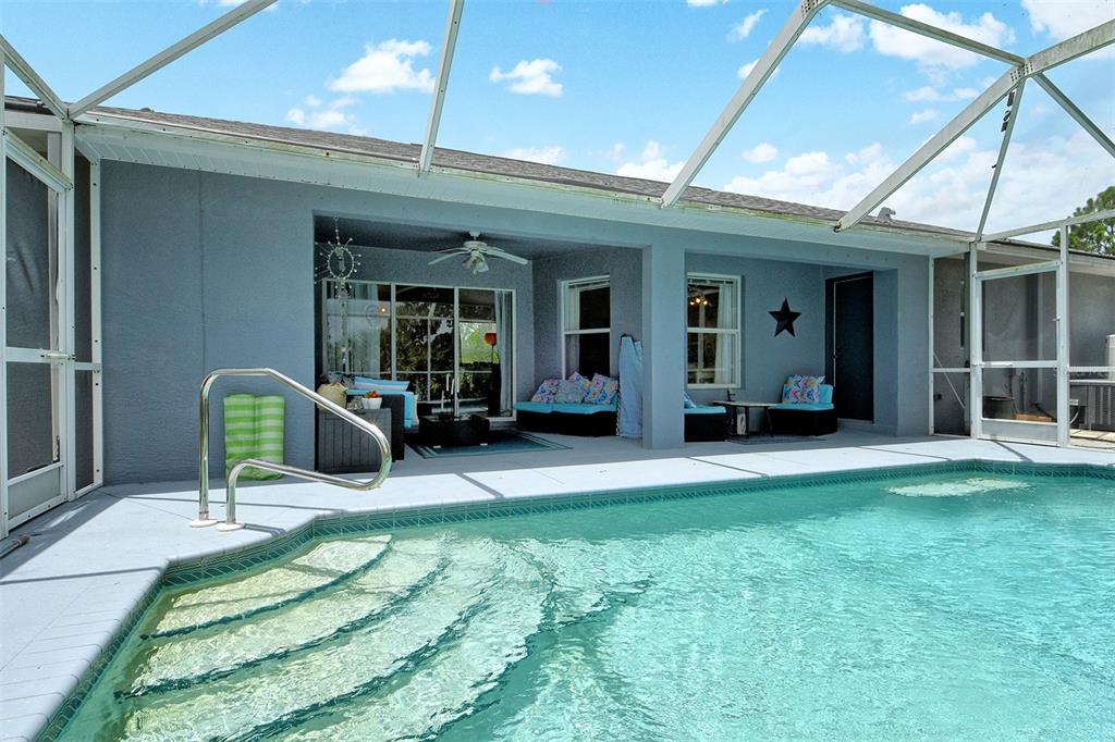 2276 Polaris Road North Port, FL 34291 - Photo 28 of 31 a view of a house with a backyard porch and sitting area