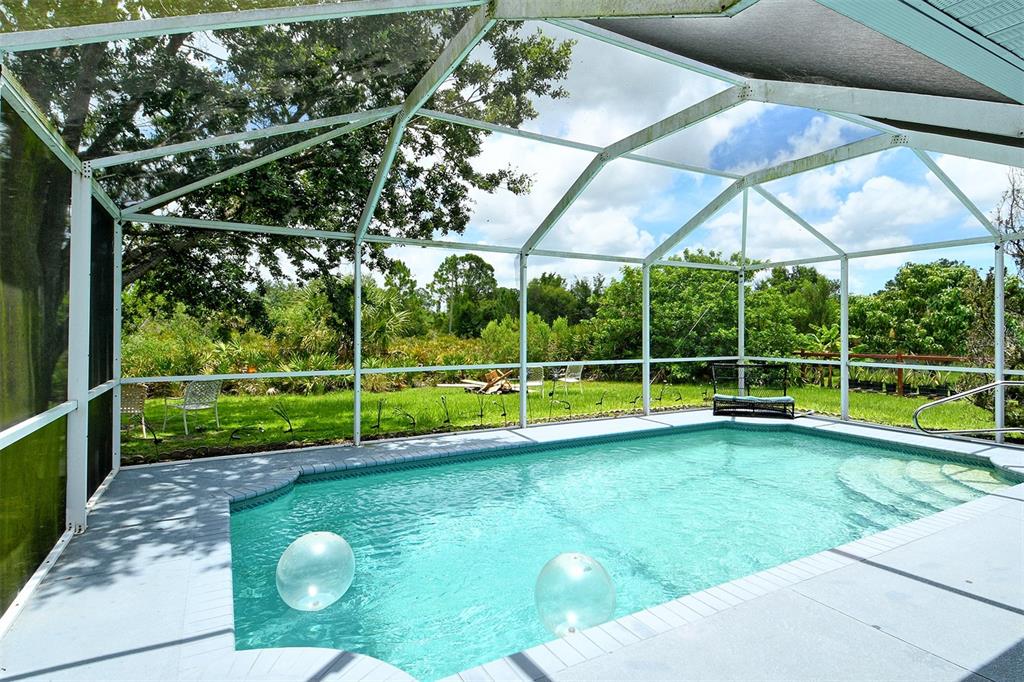 2276 Polaris Road North Port, FL 34291 - Photo 29 of 31 a view of a backyard with swimming pool