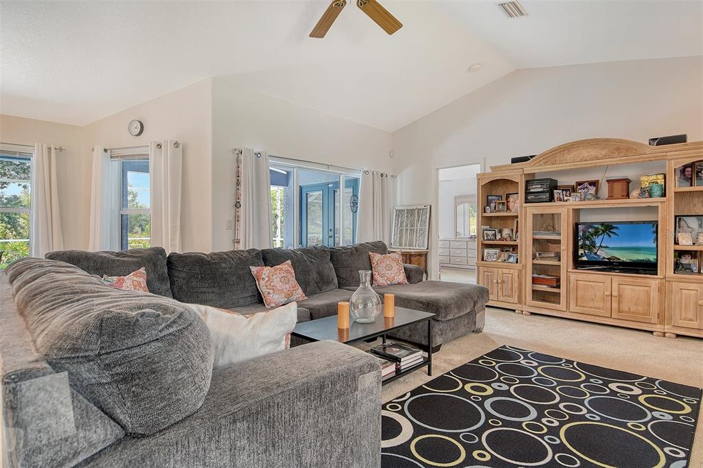 2276 Polaris Road North Port, FL 34291 - Photo 8 of 31 a living room with furniture a rug and a window