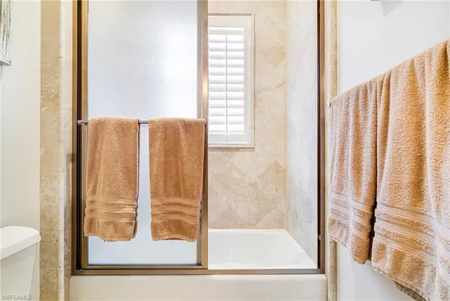 a utility room with sink dryer and washer