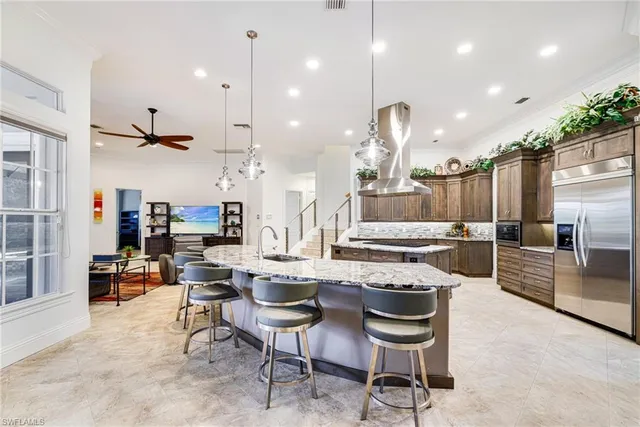 a large kitchen with a table and chairs