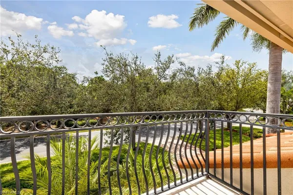 a dining room with furniture a chandelier and wooden floor