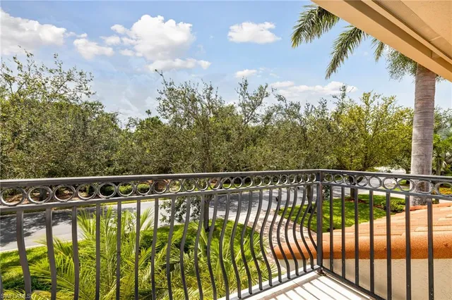 a dining room with furniture a chandelier and wooden floor