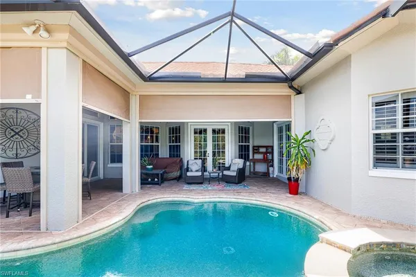 a view of a swimming pool with a patio