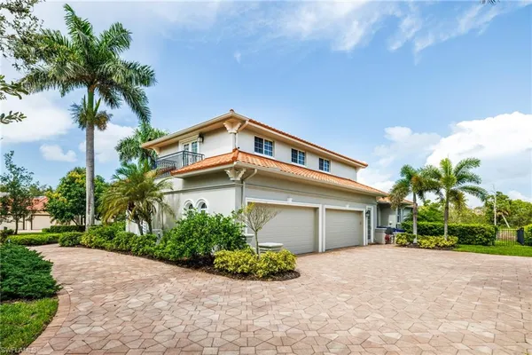 an aerial view of residential house with outdoor space and swimming pool