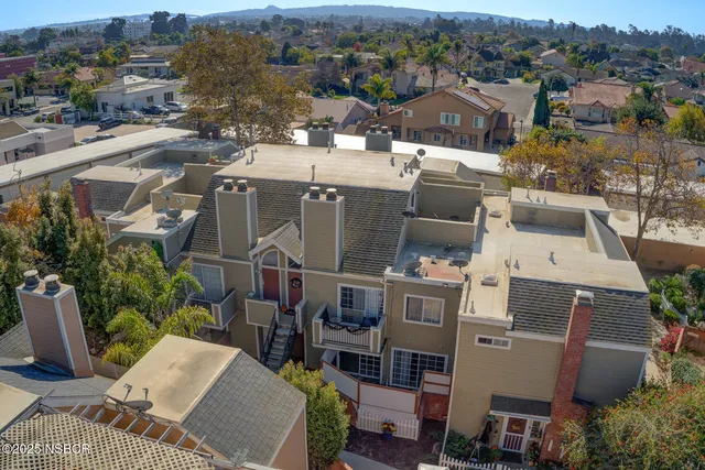 a view of a room with a sink and mirror