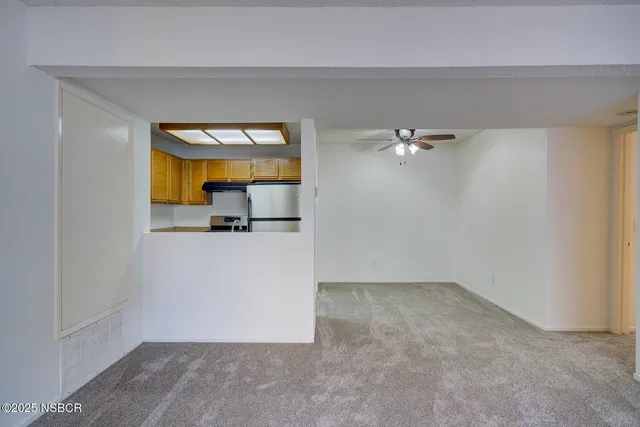 a kitchen with stainless steel appliances granite countertop a sink and a cabinets