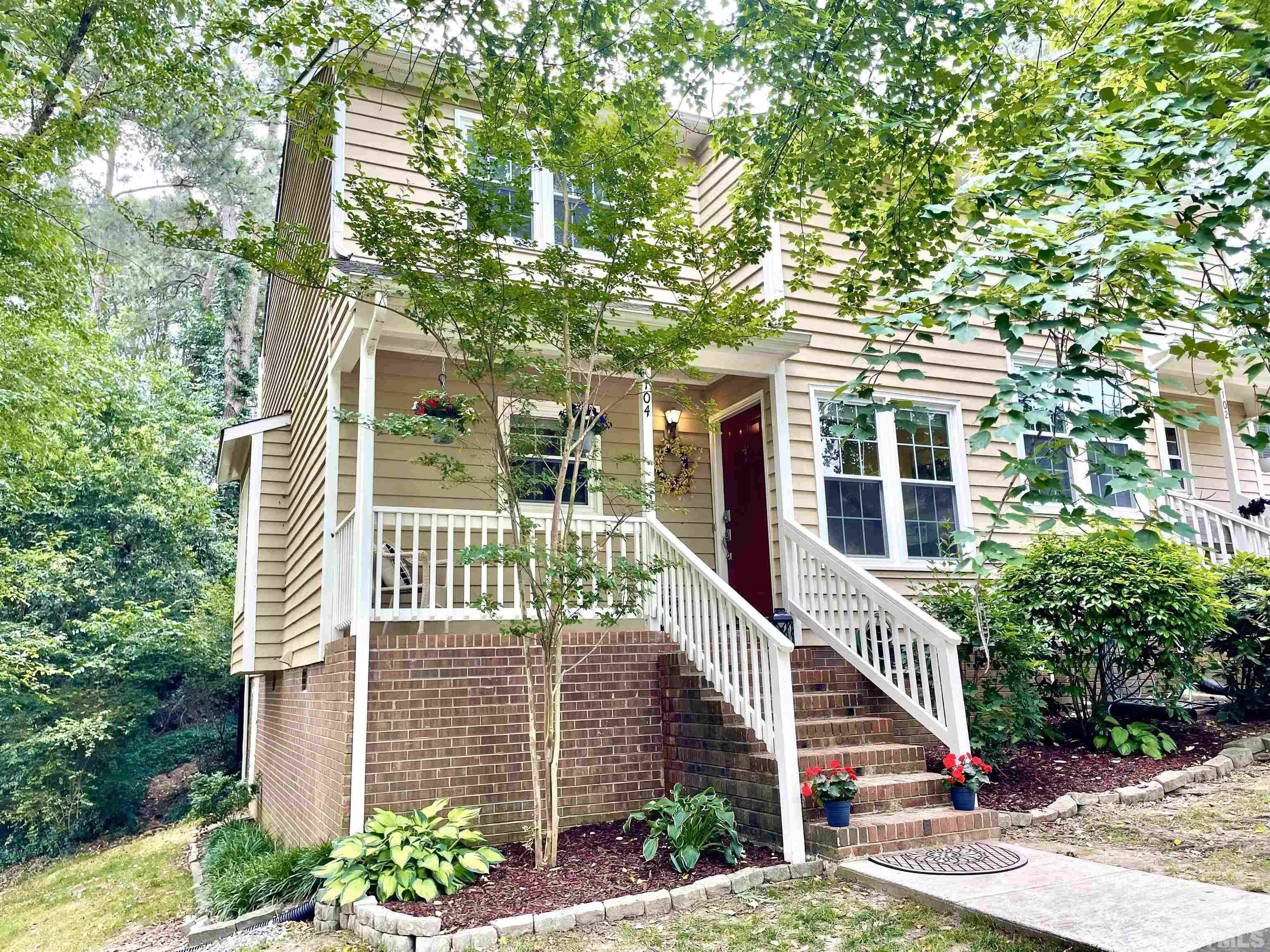 104 Long Shadow Place Durham, NC 27713 - Photo 1 of 11 a front view of a house with a tree
