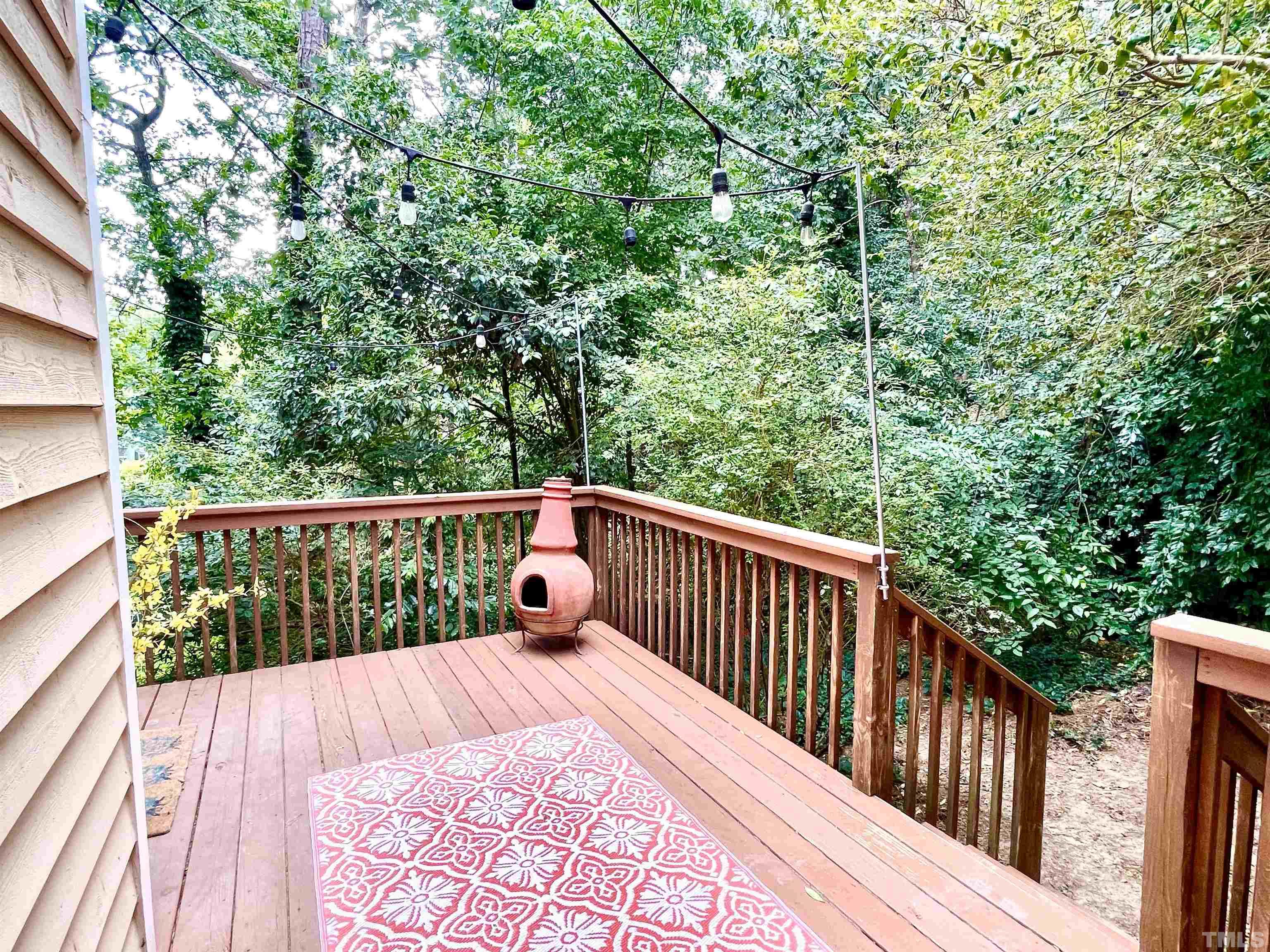 104 Long Shadow Place Durham, NC 27713 - Photo 11 of 11 a balcony with wooden floor and trees
