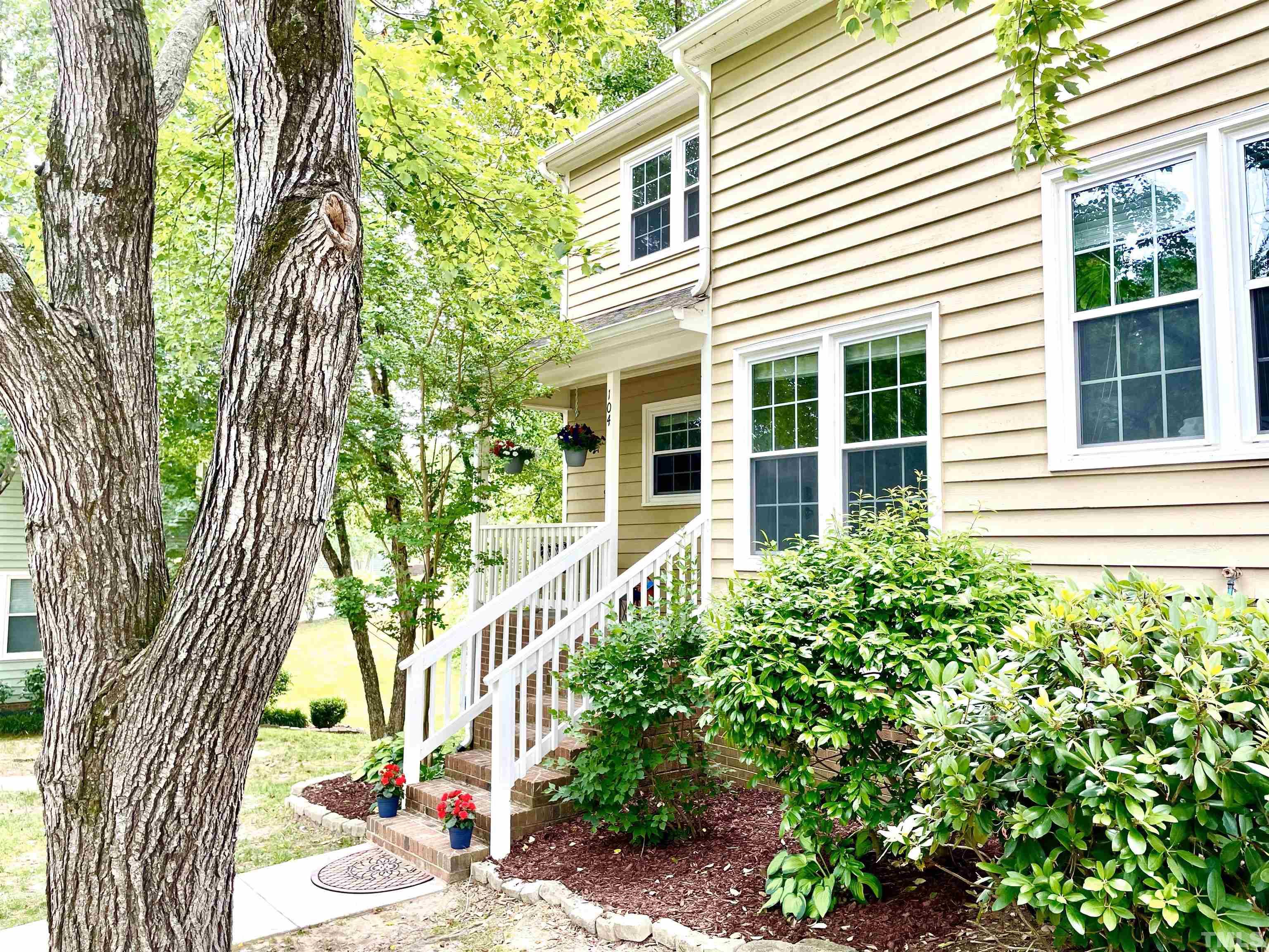 104 Long Shadow Place Durham, NC 27713 - Photo 2 of 11 a front view of a house with a yard