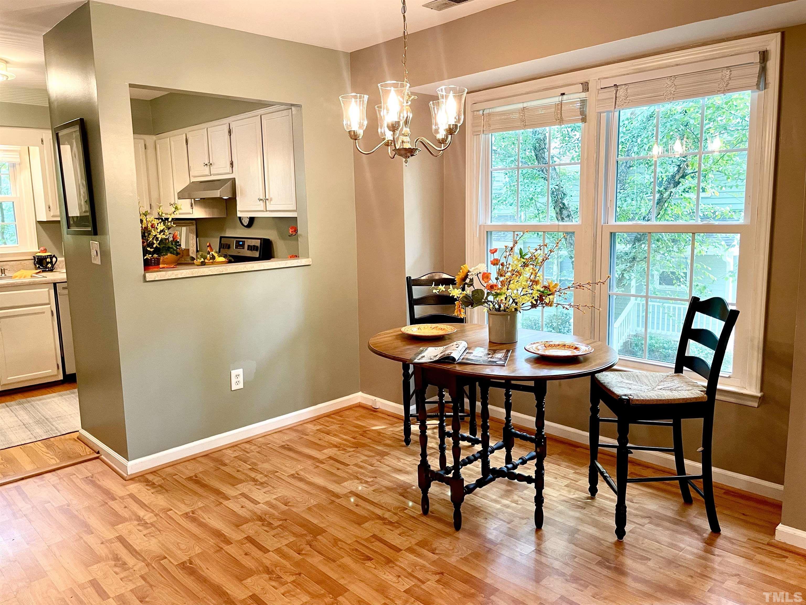 104 Long Shadow Place Durham, NC 27713 - Photo 4 of 11 a view of a dining room with furniture window and outside view