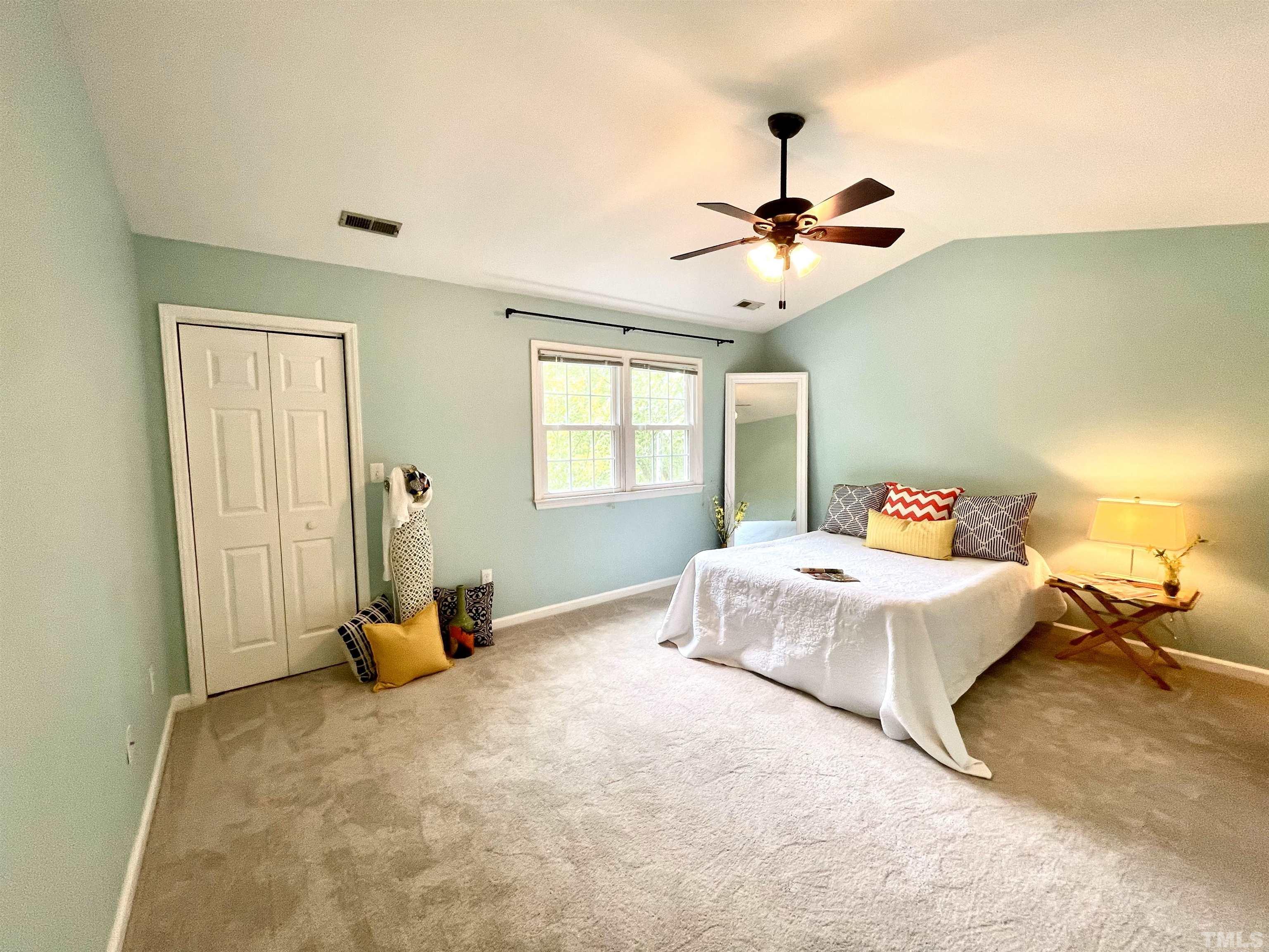 104 Long Shadow Place Durham, NC 27713 - Photo 7 of 11 a spacious bedroom with a bed and window