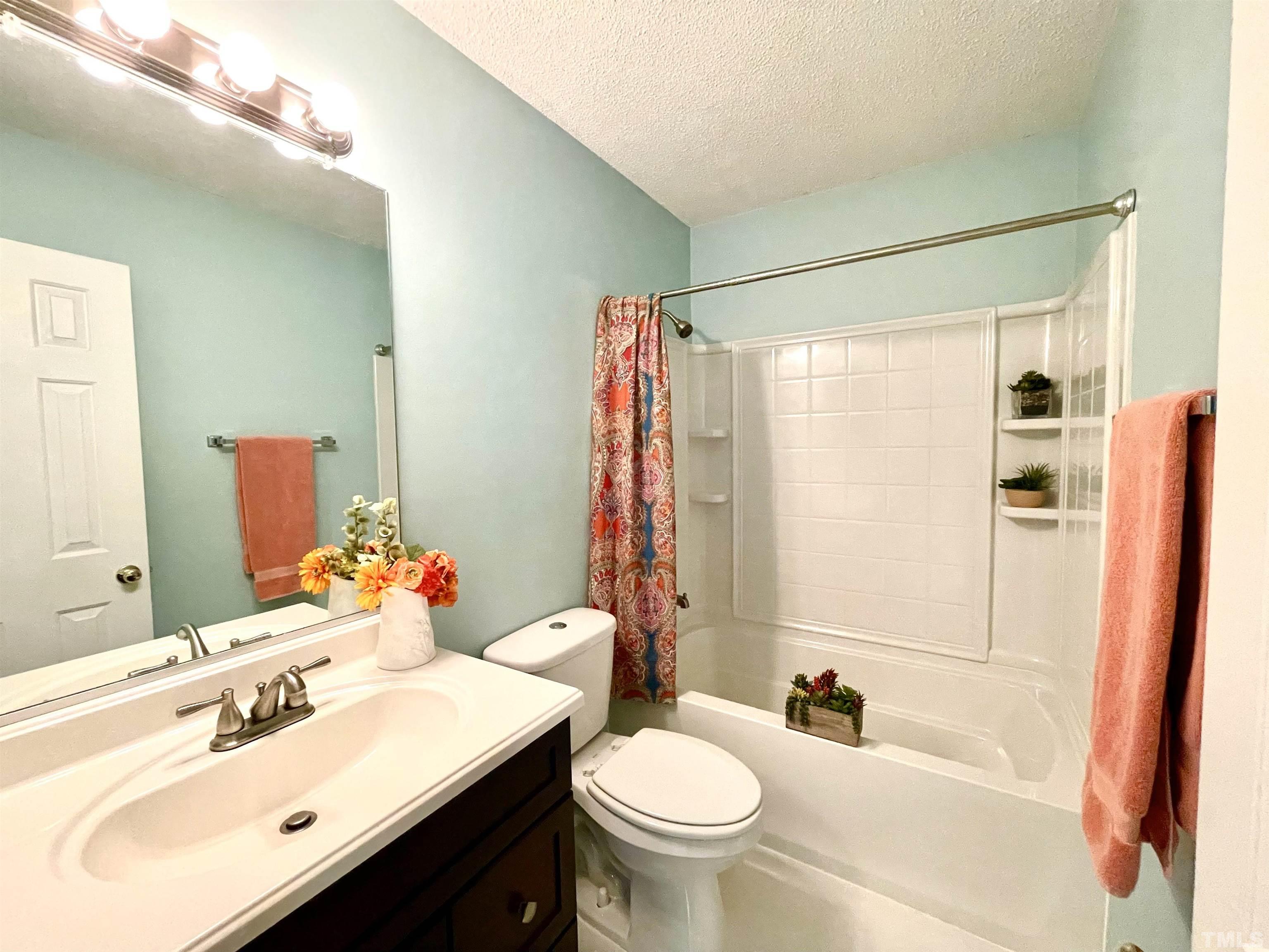 104 Long Shadow Place Durham, NC 27713 - Photo 10 of 11 a bathroom with a sink toilet tub and shower