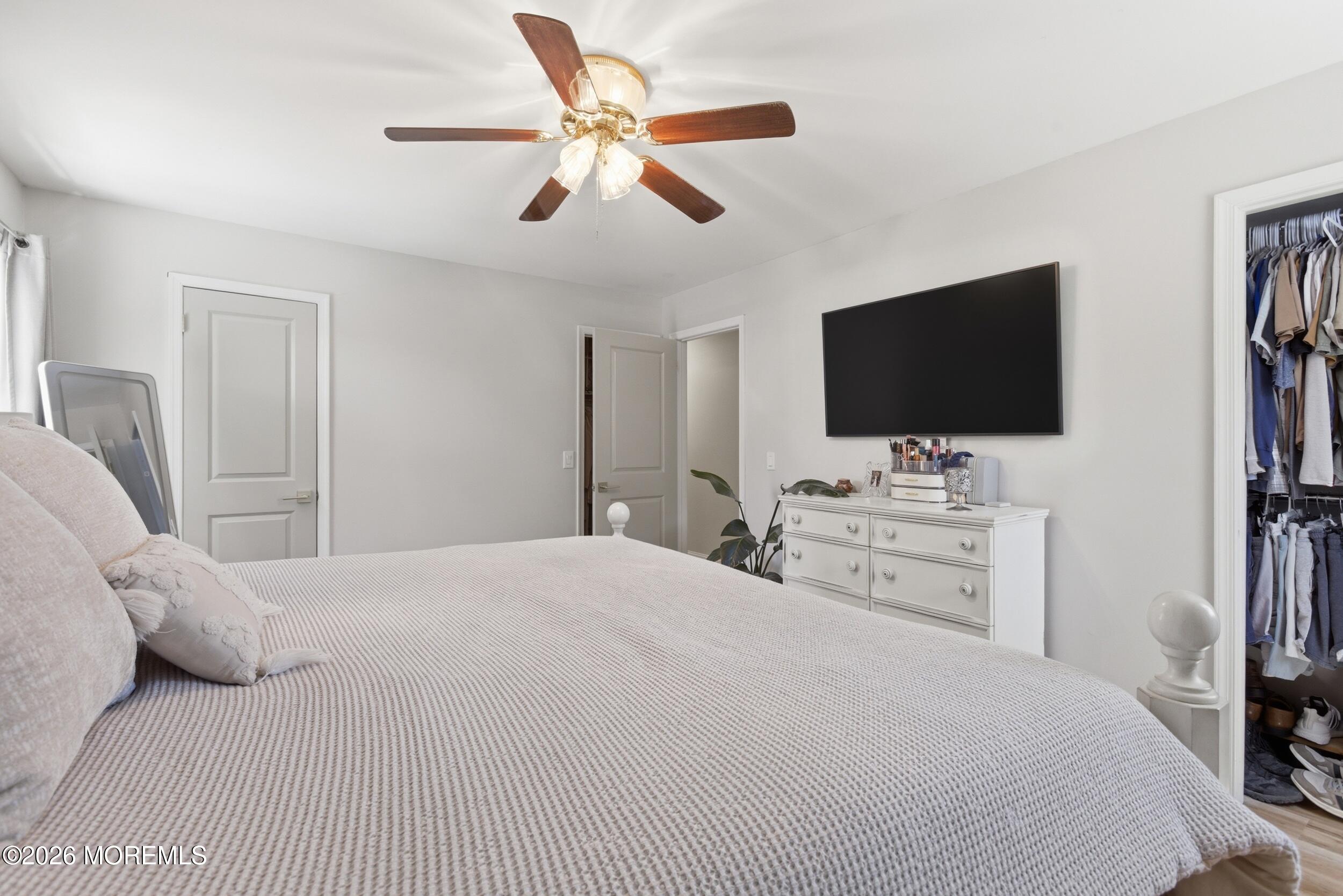 1635 Burrsville Road Brick, NJ 08724 - Photo 24 of 64 a bedroom with a bed and a flat screen tv