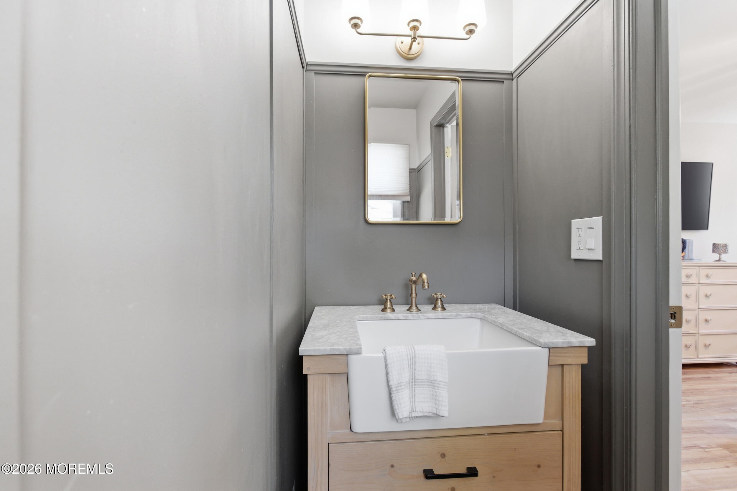 1635 Burrsville Road Brick, NJ 08724 - Photo 26 of 64 a bathroom with a sink and mirror