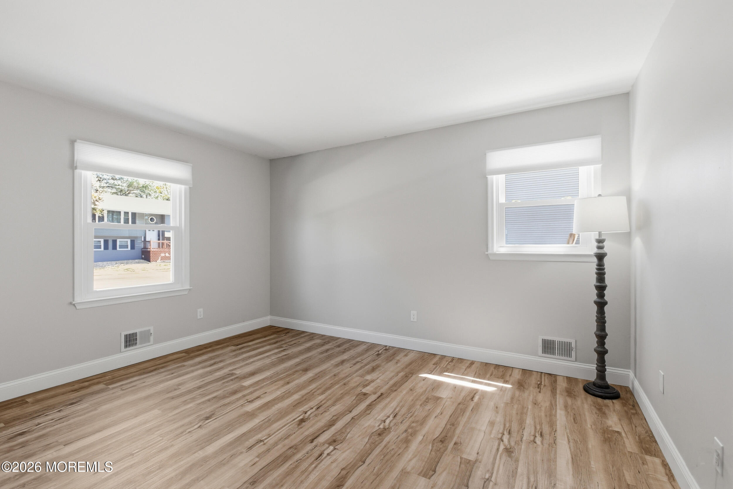1635 Burrsville Road Brick, NJ 08724 - Photo 28 of 64 an empty room with a hardwood and a window
