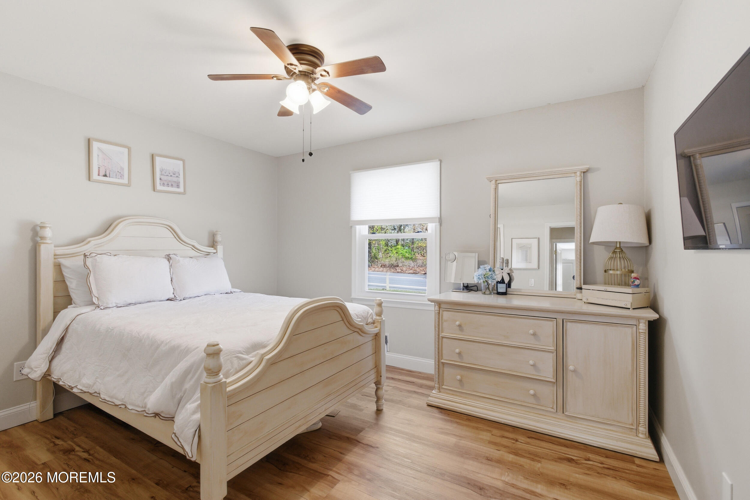 1635 Burrsville Road Brick, NJ 08724 - Photo 30 of 64 a bedroom with a bed and a chandelier
