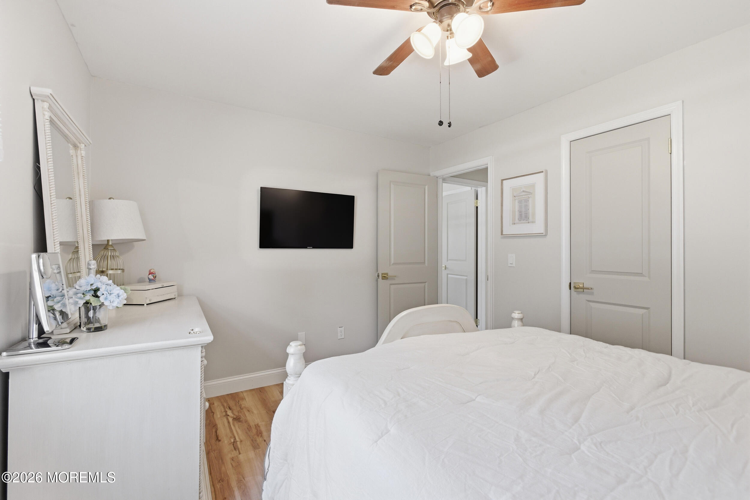 1635 Burrsville Road Brick, NJ 08724 - Photo 31 of 64 a bedroom with a bed and a flat screen tv
