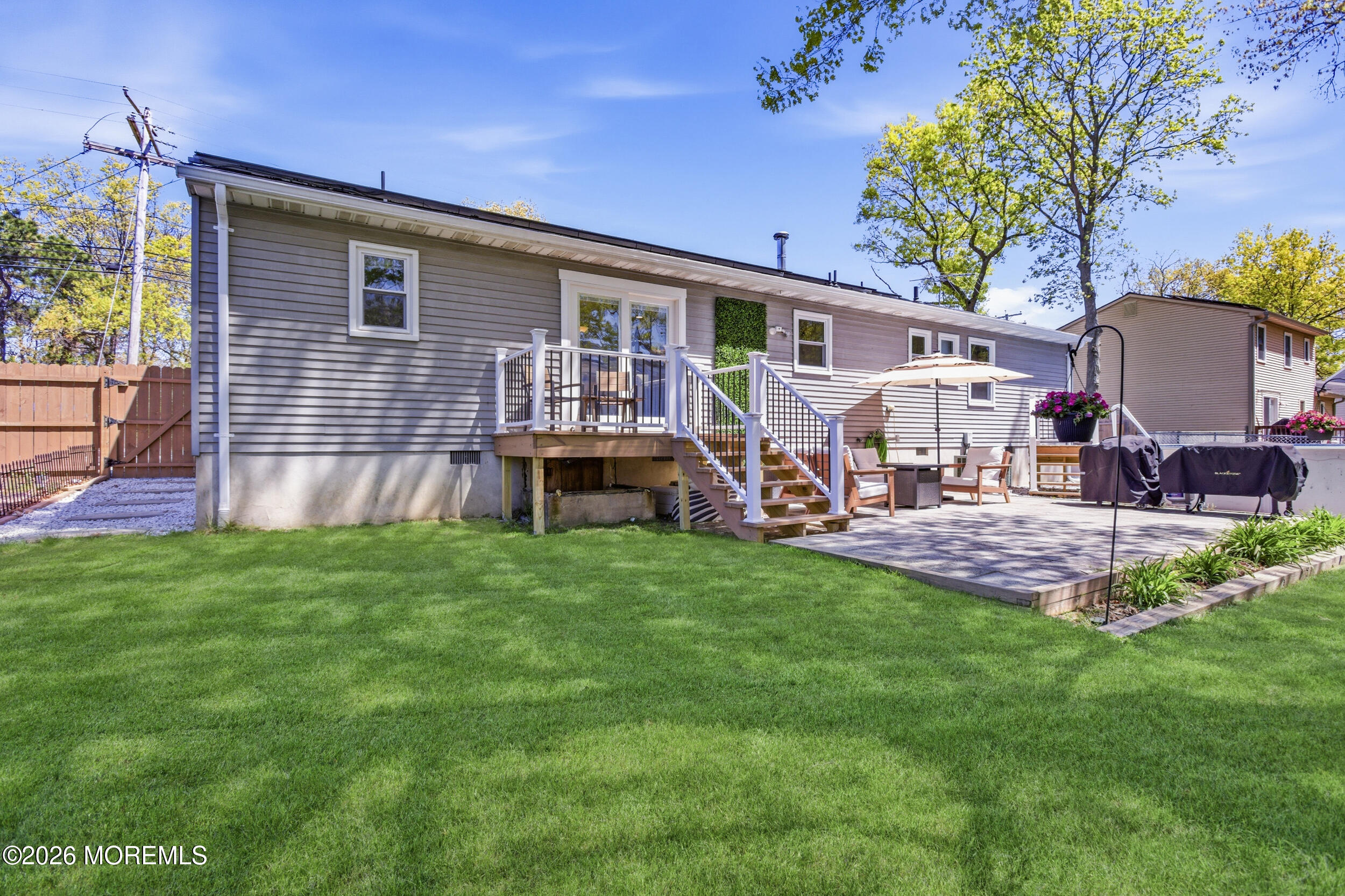 1635 Burrsville Road Brick, NJ 08724 - Photo 34 of 64 a view of a house with a backyard and a patio