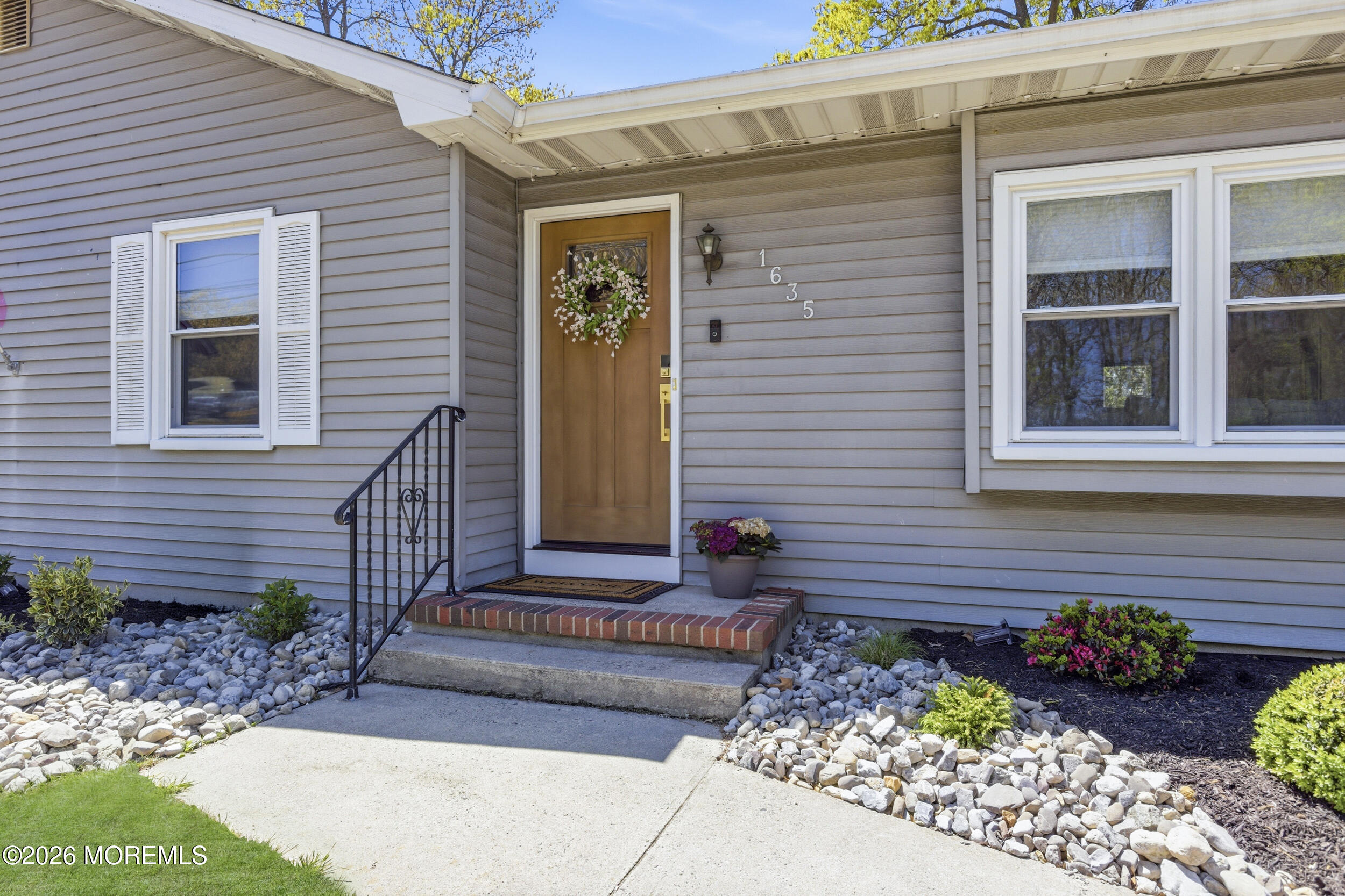 1635 Burrsville Road Brick, NJ 08724 - Photo 5 of 64 a front view of a house with a garden