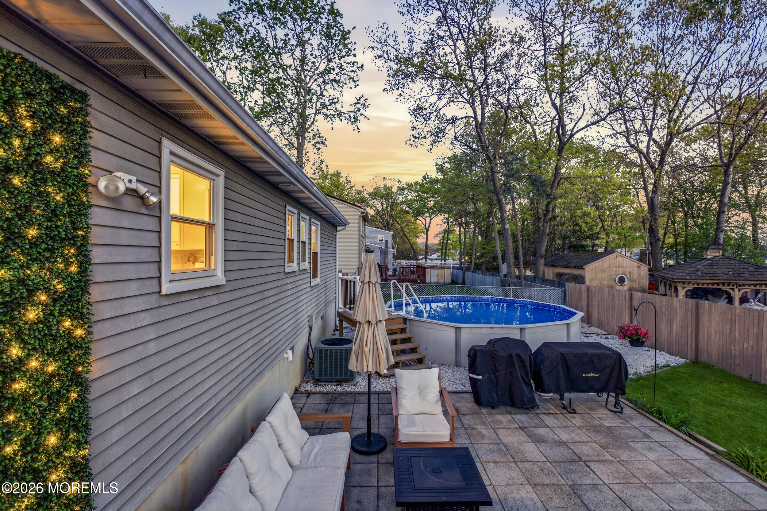 1635 Burrsville Road Brick, NJ 08724 - Photo 51 of 64 a view of a patio with table and chairs and a barbeque