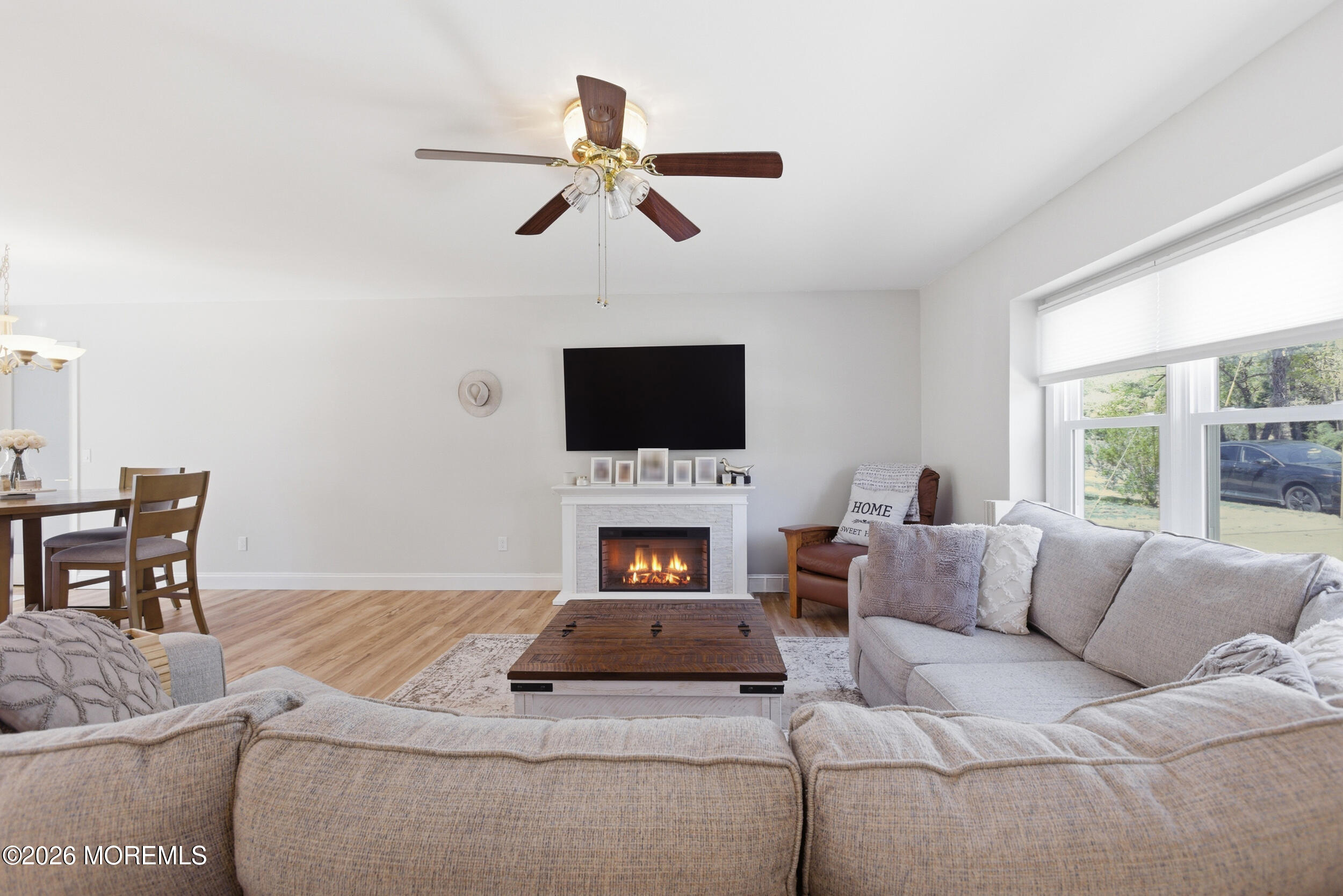 1635 Burrsville Road Brick, NJ 08724 - Photo 10 of 64 a living room with furniture a fireplace and a flat screen tv