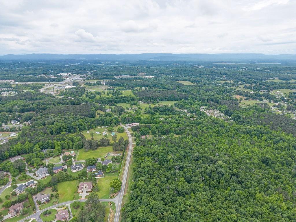 2148 Red Bud Road Northeast Calhoun, GA 30701 - Photo 7 of 18 an aerial view of residential houses with outdoor space and trees