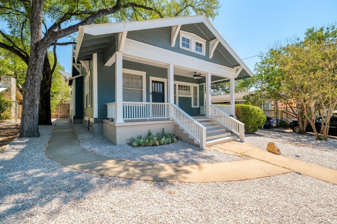 1909 David Street Austin, TX 78705 - Photo 1 of 1 a view of a white house with large windows next to a road