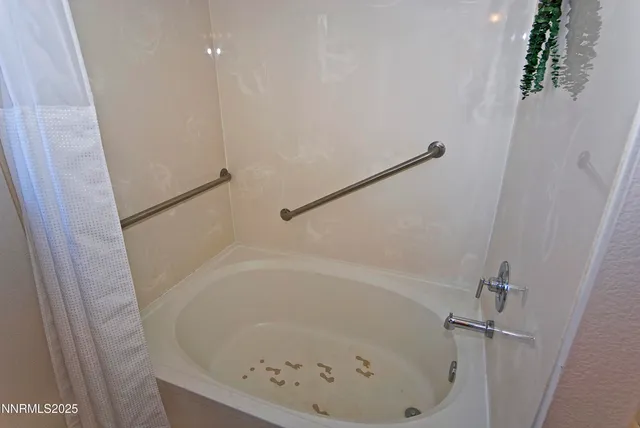 a close view of a bathtub in bathroom
