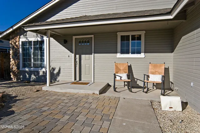 a backyard of a house with seating space