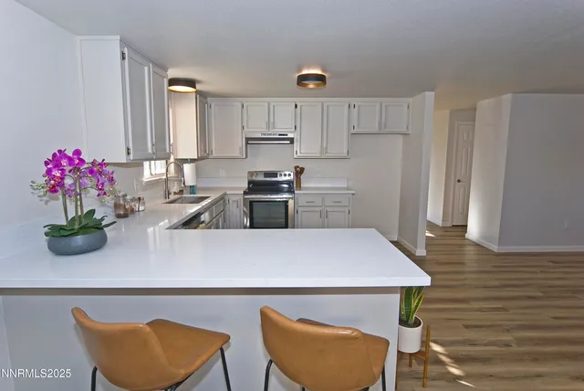 a kitchen with a table and chairs