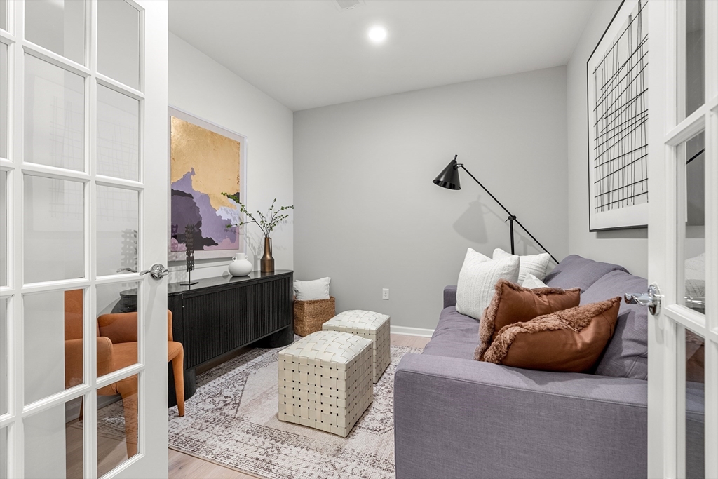 30 Coppersmith Way, Unit 409 Canton, MA 02021 - Photo 12 of 26 a living room with furniture and a window