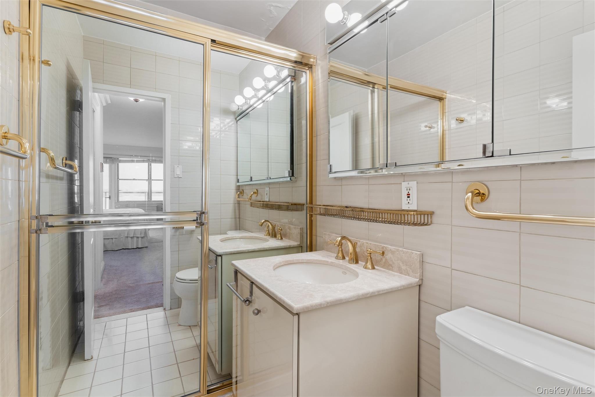 17-85 215th Street, Unit 15M Queens, NY 11360 - Photo 21 of 30 a bathroom with a sink toilet and shower