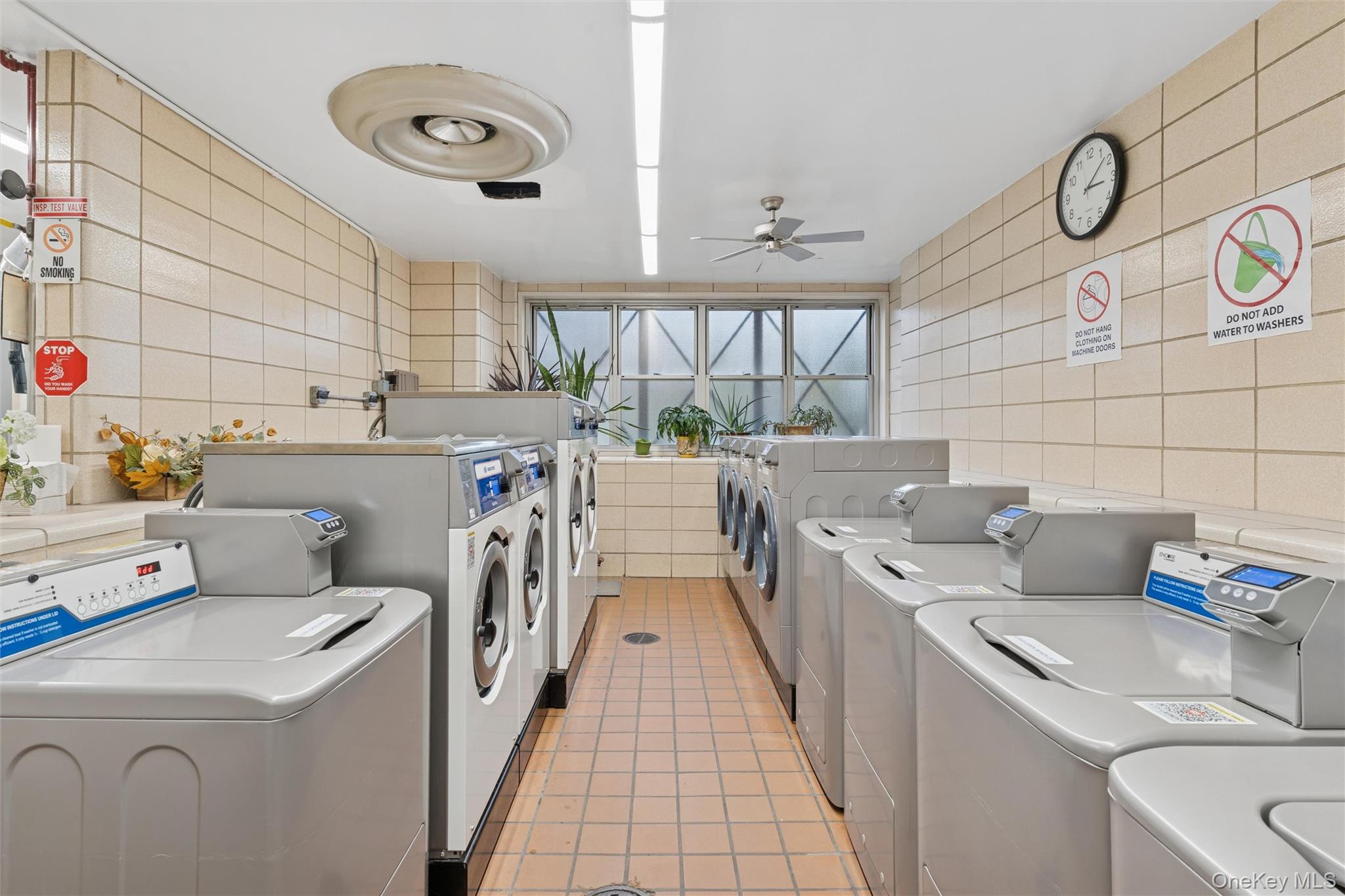 17-85 215th Street, Unit 15M Queens, NY 11360 - Photo 25 of 30 a kitchen with a sink and a stove top oven