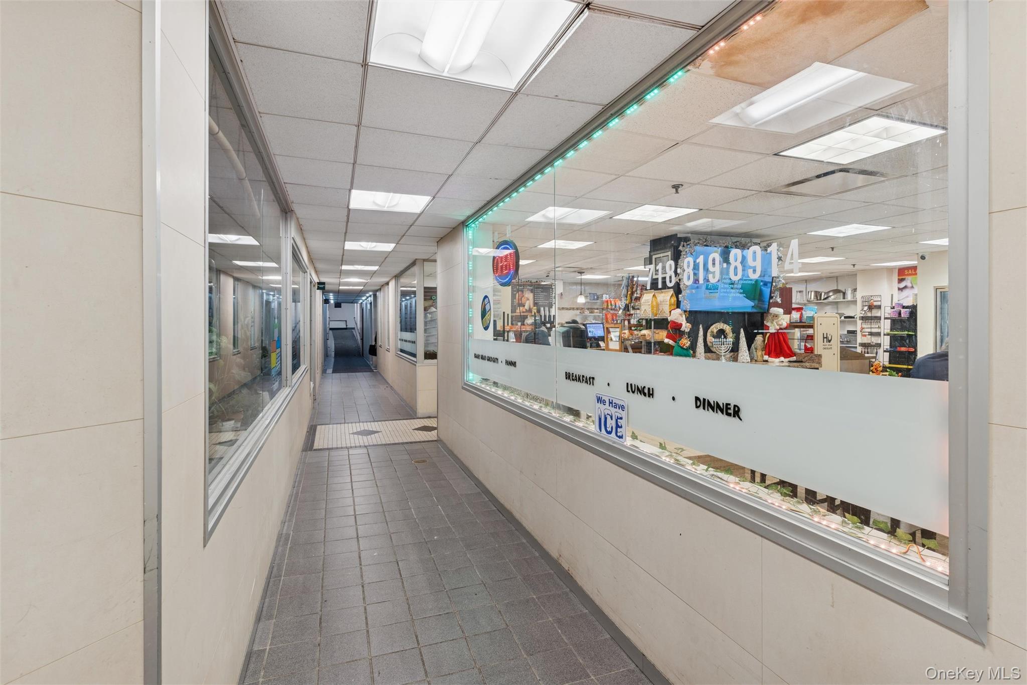 17-85 215th Street, Unit 15M Queens, NY 11360 - Photo 27 of 30 a very nice looking room with a lot of stuff