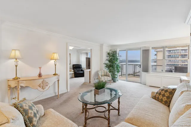 a view of a dining room with furniture large windows and wooden floor