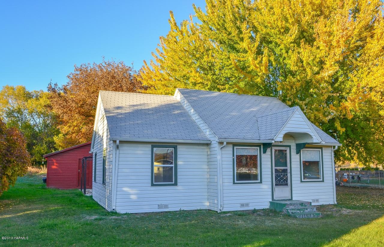 11703 Gilbert Road Yakima, WA 98903 - Photo 1 of 12 a view of a house with a yard