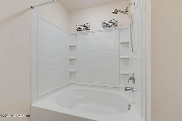 a close view of a bathtub in bathroom