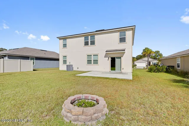a house view with swimming pool in front of it