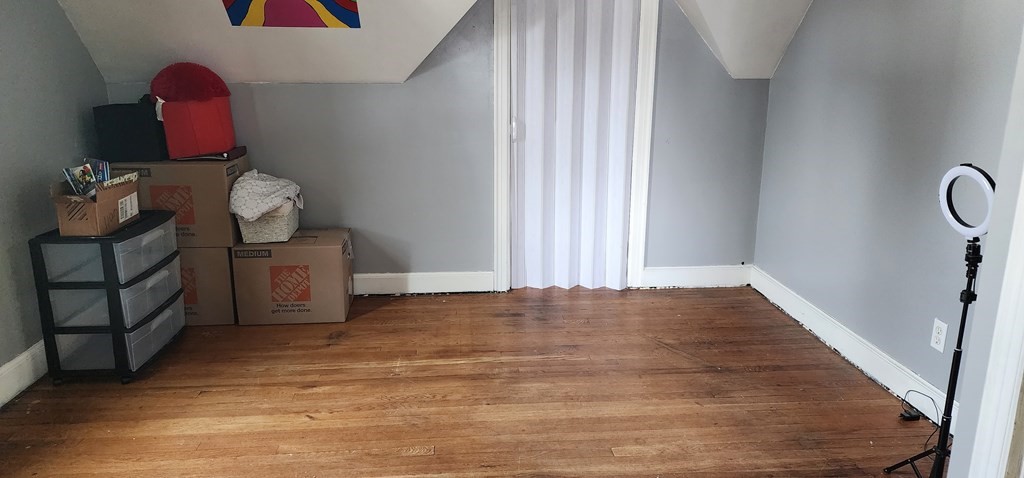 16 Abbott Street Springfield, MA 01118 - Photo 24 of 24 a view of a room with wooden floor and fan
