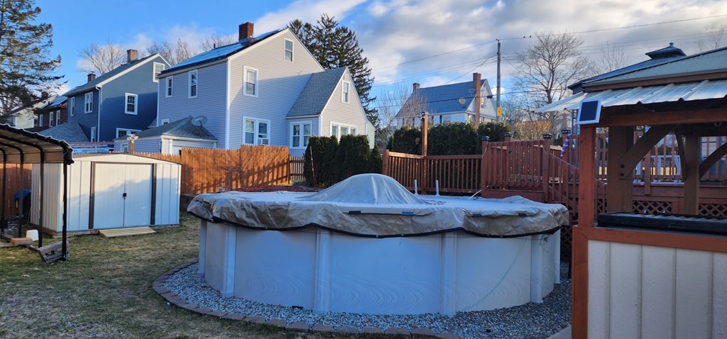 16 Abbott Street Springfield, MA 01118 - Photo 7 of 24 a view of a house with a bath tub and wooden fence