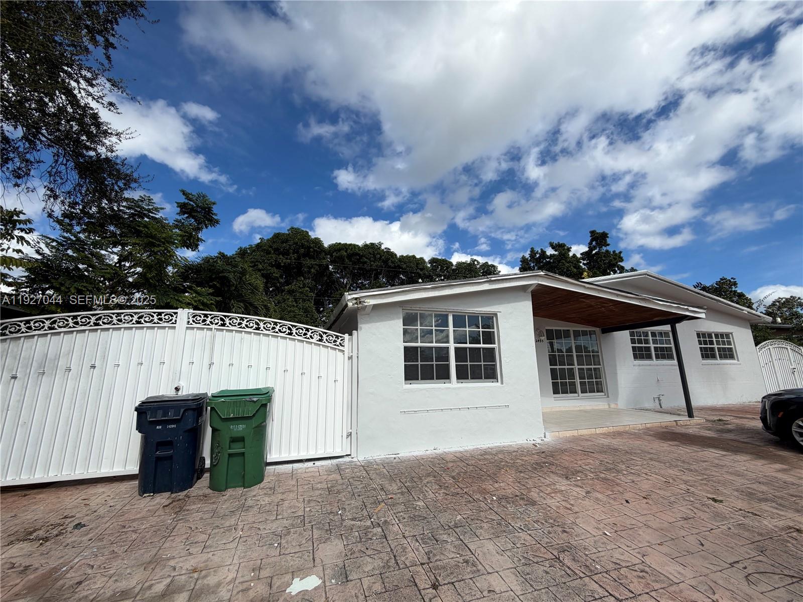 12455 Southwest 185th Terrace Miami, FL 33177 - Photo 17 of 18 a view of a house with a backyard