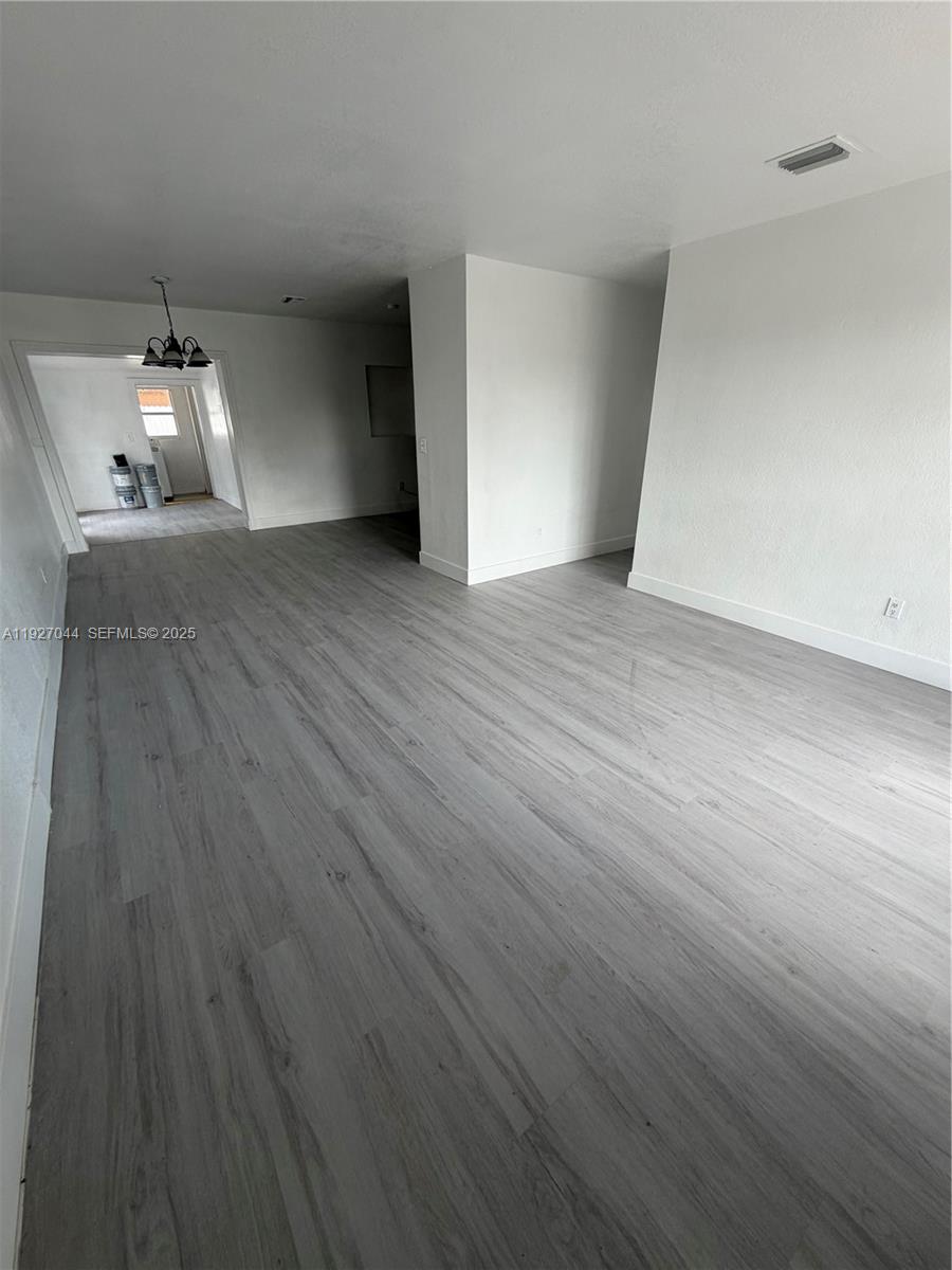 12455 Southwest 185th Terrace Miami, FL 33177 - Photo 2 of 18 a view of empty room with wooden floor